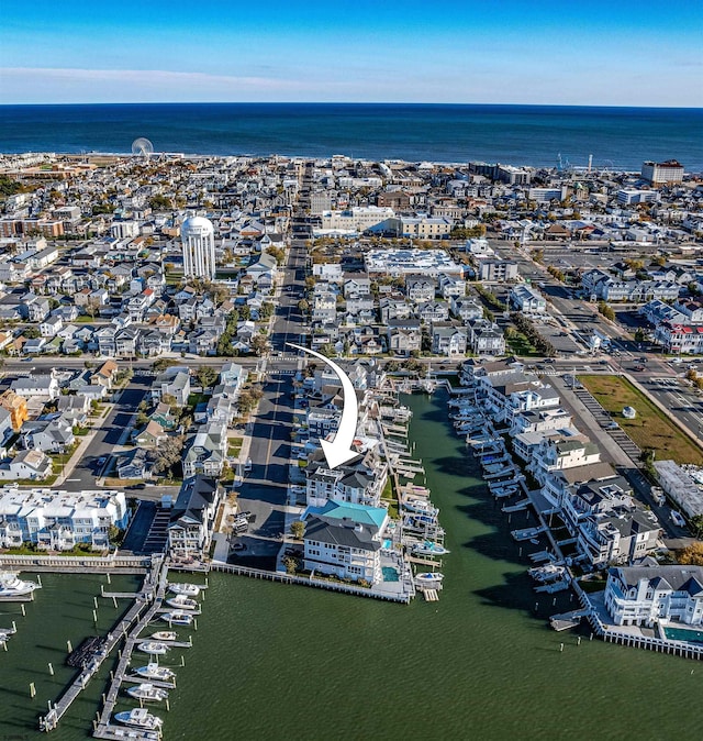 birds eye view of property featuring a water view