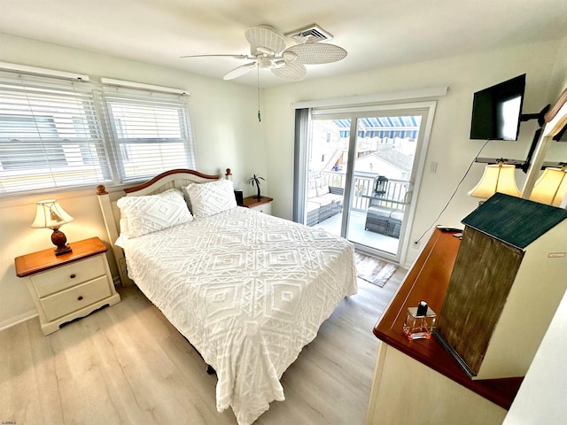 bedroom with multiple windows, access to outside, light hardwood / wood-style floors, and ceiling fan