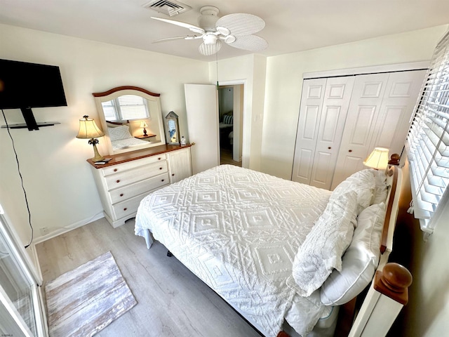 bedroom featuring a closet, ceiling fan, and light wood-type flooring