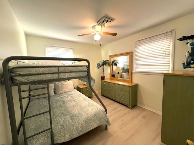 bedroom featuring ceiling fan and light hardwood / wood-style flooring