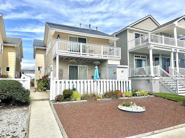 view of front of home with a balcony and a porch