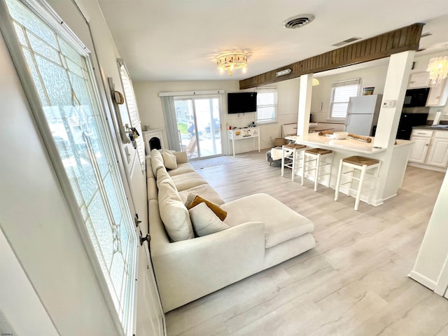 living room with light hardwood / wood-style floors