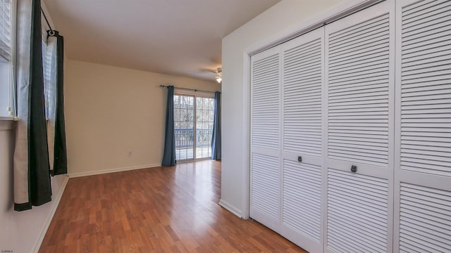 corridor with dark wood-type flooring