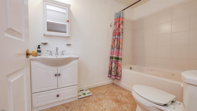 full bathroom featuring vanity, toilet, and shower / tub combo