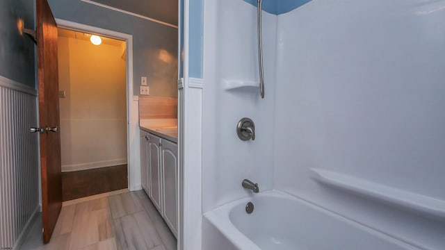 bathroom with vanity and shower / tub combination