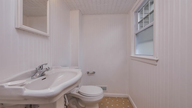 bathroom with sink, tile patterned floors, and toilet