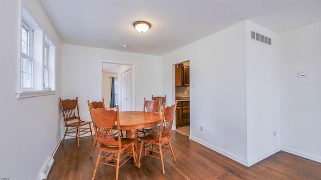 dining room featuring dark hardwood / wood-style flooring