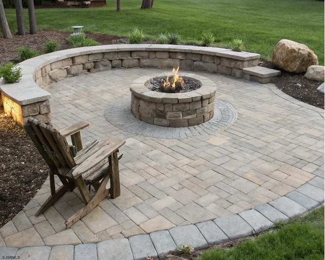 view of patio / terrace with an outdoor fire pit