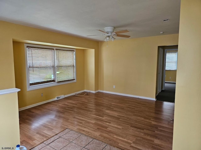 645 Green St, Atlantic City, NJ 08401 - spare room with visible vents, baseboards, a ceiling fan, and wood finished floors