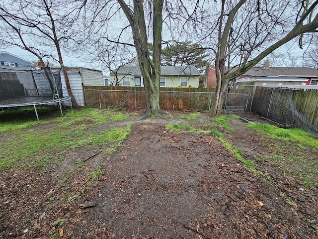 645 Green St, Atlantic City, NJ 08401 - view of yard featuring a trampoline and a fenced backyard