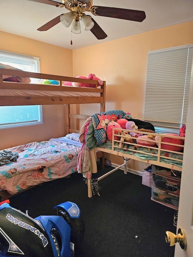 bedroom featuring ceiling fan and carpet floors