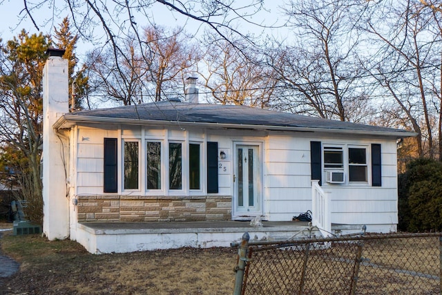 view of front of house featuring cooling unit