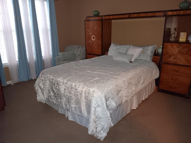 bedroom with light colored carpet