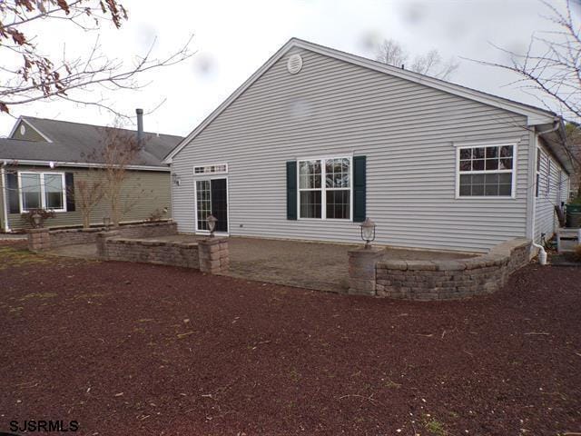 back of property with a patio area