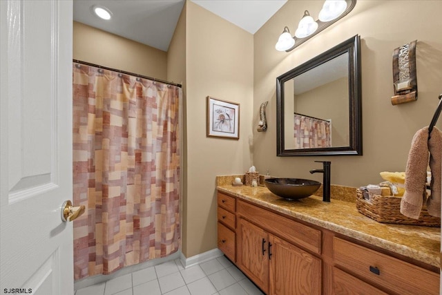 bathroom with tile patterned flooring, vanity, and a shower with shower curtain