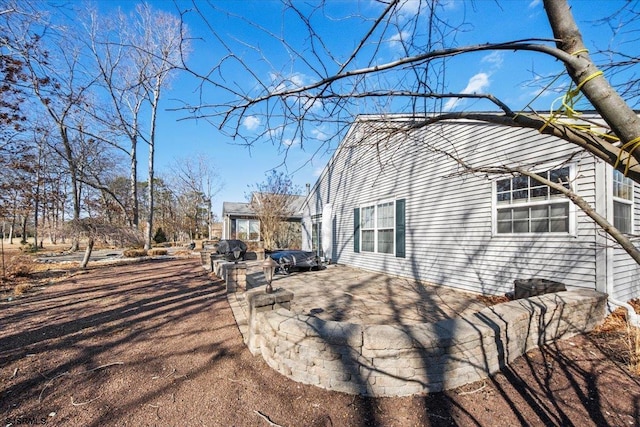 view of home's exterior featuring a patio area