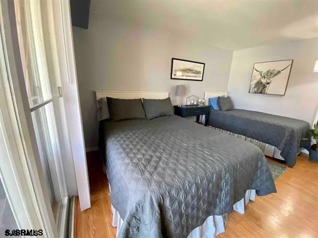 bedroom with light hardwood / wood-style flooring