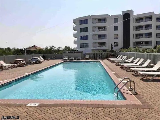 view of swimming pool featuring a patio