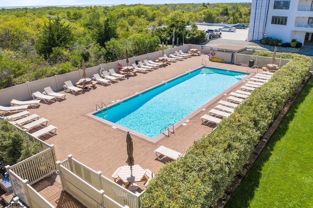 view of swimming pool featuring a patio area