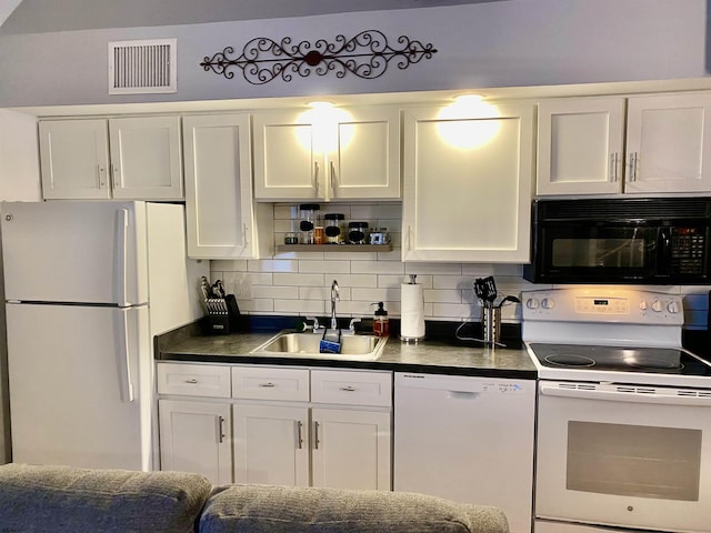 kitchen with white cabinetry, sink, white appliances, and backsplash