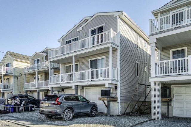 exterior space with cooling unit and a garage