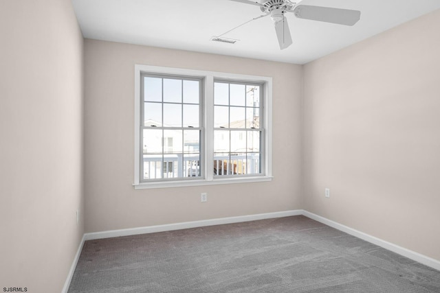 empty room featuring carpet floors and ceiling fan