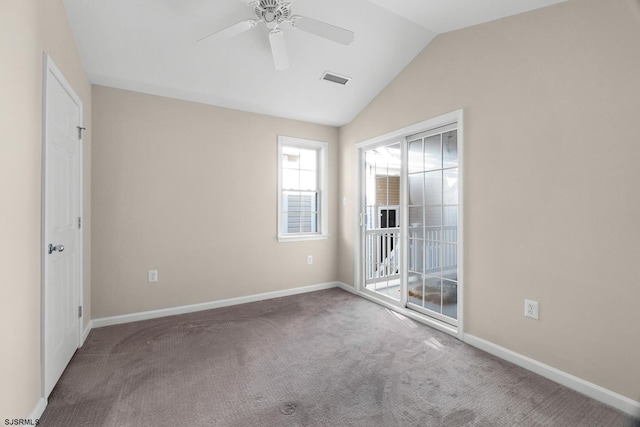 carpeted empty room with lofted ceiling and ceiling fan