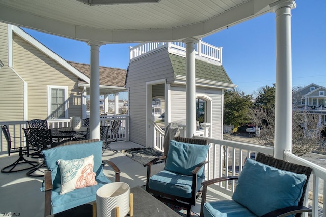 view of patio featuring a balcony