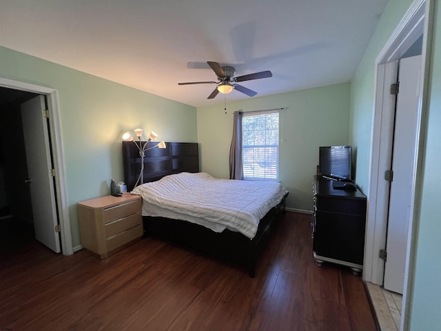 bedroom featuring dark wood-type flooring and ceiling fan