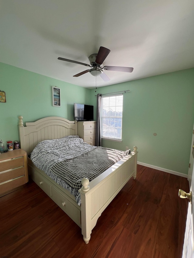 bedroom featuring dark hardwood / wood-style flooring and ceiling fan