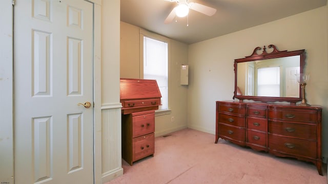 bedroom featuring light carpet and ceiling fan