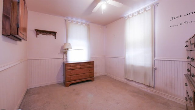 empty room with light carpet and ceiling fan