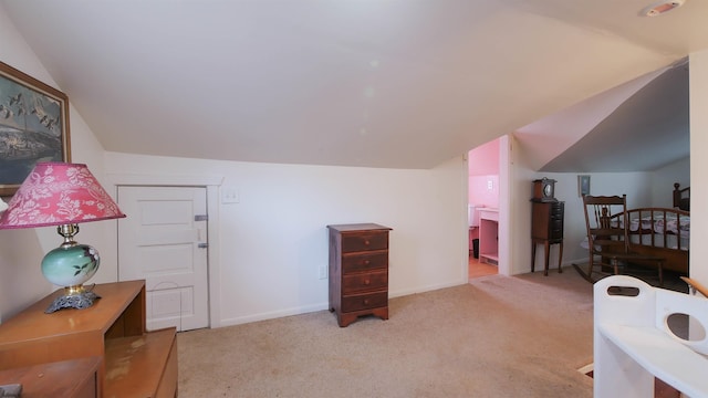 carpeted bedroom with vaulted ceiling