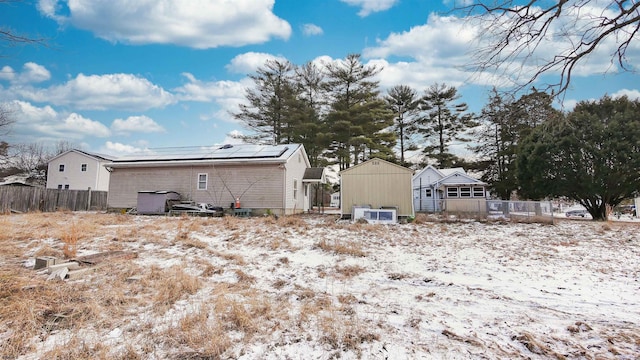 view of snow covered house