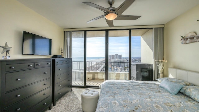 bedroom featuring floor to ceiling windows, light carpet, access to outside, and ceiling fan