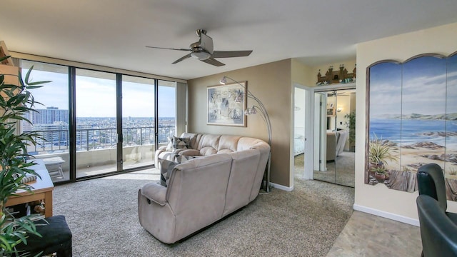 living room featuring expansive windows and ceiling fan