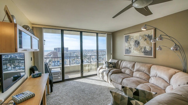 carpeted living room featuring floor to ceiling windows and ceiling fan