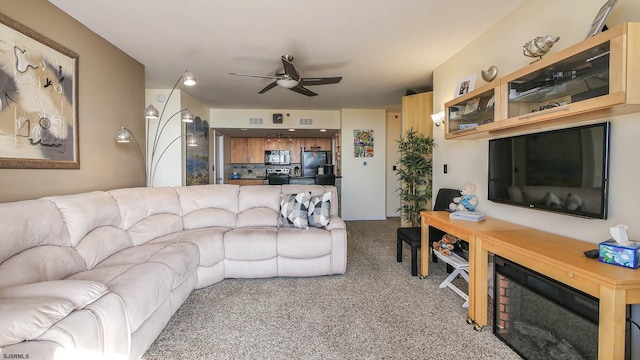 living room featuring ceiling fan and carpet flooring