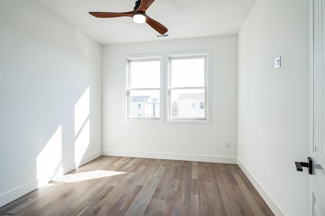 unfurnished room with ceiling fan and light wood-type flooring