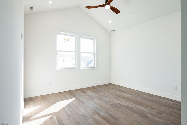 unfurnished room featuring vaulted ceiling, ceiling fan, and light hardwood / wood-style floors