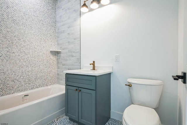 full bathroom with tile patterned flooring, vanity, tiled shower / bath, and toilet