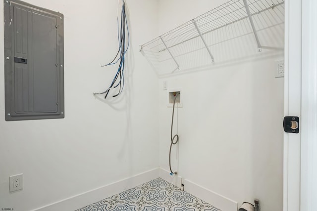 laundry room with light tile patterned floors, hookup for a washing machine, and electric panel