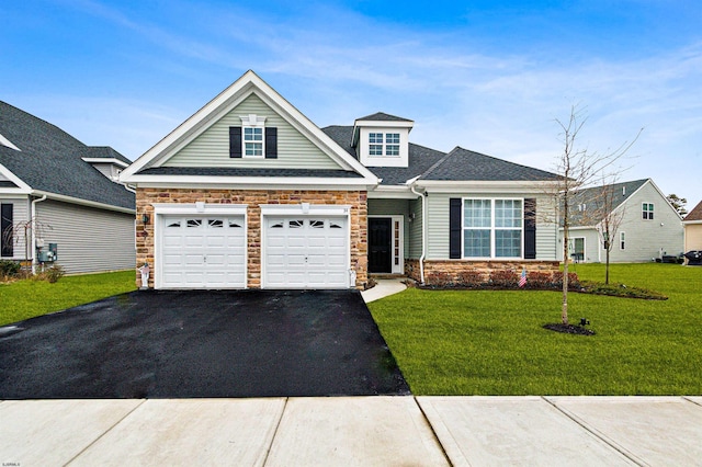 craftsman-style home featuring a garage and a front yard