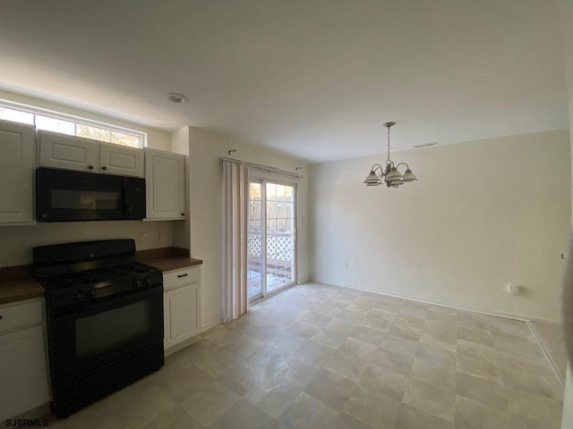 kitchen with white cabinetry, pendant lighting, black appliances, and an inviting chandelier