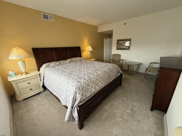 bedroom featuring light carpet