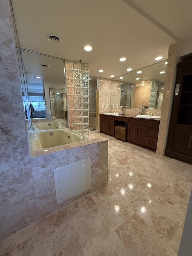 bathroom featuring vanity and separate shower and tub