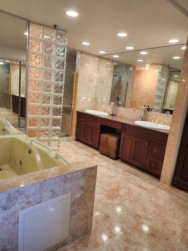 bathroom featuring tile walls, vanity, and a shower