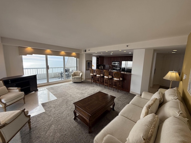 living room featuring a water view