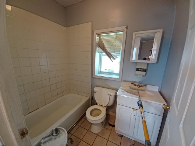 bathroom featuring vanity, tile patterned floors, and toilet