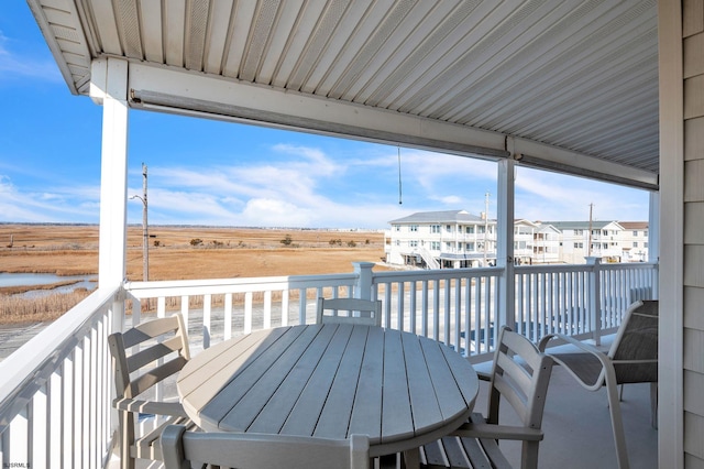 wooden terrace featuring a rural view